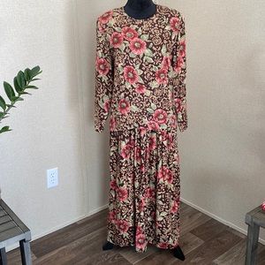 Casual Corner 100% Rayon made in the USA.  2 pieces long sleeve and long skirt.